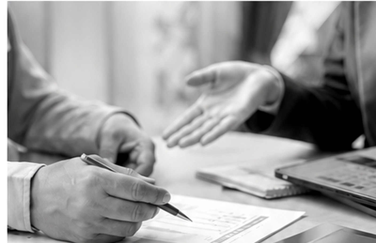 Professionals reviewing procurement documents together